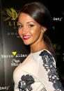 Michelle Keegan teamed her red lipstick with a golden fake tan. [Rex]