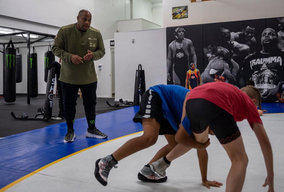 Daniel 'DC' Cormier, former UFC heavyweight champion trains two students inside the Daniel Cormier Wrestling Academy in Gilroy, Calif., on Tuesday  Nov. 23, 2021. 