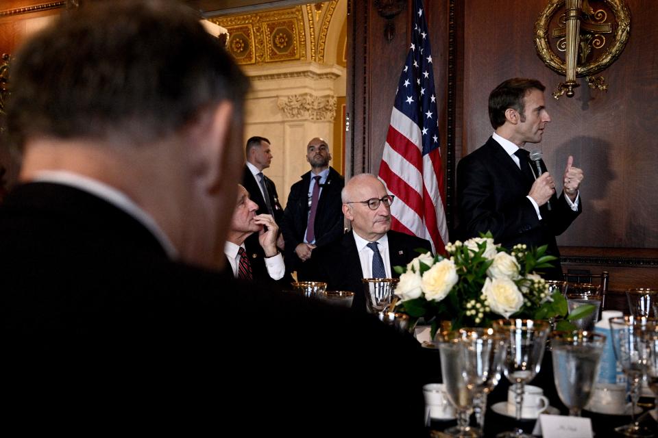 French president Emmanuel Macron speaks during a working lunch on climate and biodiversity issues with US Climate Envoy John Kerry, members of the United States Congress, and key US stakeholders on climate, at the Library of Congress in Washington, DC, on 30 November 2022 (AFP via Getty Images)