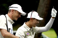 Jazz Janewattananond, of Thailand, smiles after hitting from the 18th tee during the first round for the men's golf event at the 2020 Summer Olympics, Thursday, July 29, 2021, at the Kasumigaseki Country Club in Kawagoe, Japan, (AP Photo/Matt York)