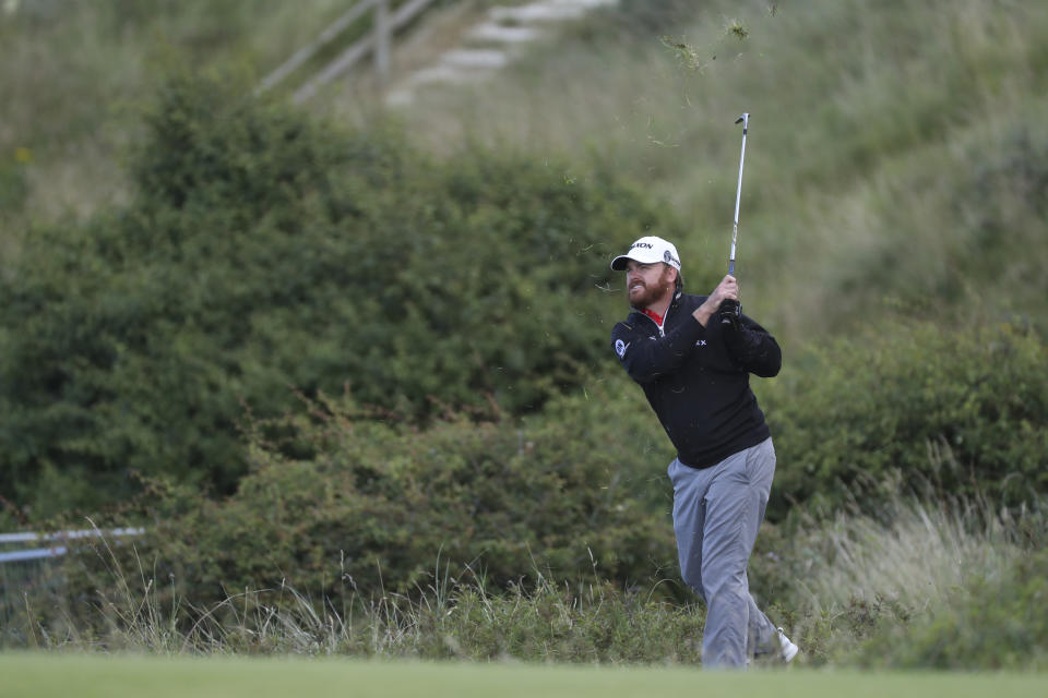 J.B. Holmes of the United States hits a shot on the 5th hole during the third round of the British Open Golf Championships at Royal Portrush in Northern Ireland, Saturday, July 20, 2019.(AP Photo/Peter Morrison)