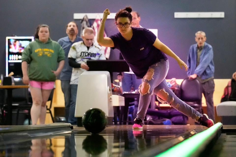 Katie Nichols bowls at Just In Time Recreation during the reopening of the bowling alley six months after a deadly mass shooting, Friday, May 3, 2024, in Lewiston, Maine. (AP Photo/Robert F. Bukaty)