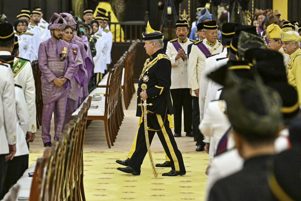 Sultan Ibrahim Sultan Iskandar, center, arrives for the oath taking ceremony as the Malaysia’s 17th king at the National Palace in Kuala Lumpur in Kuala Lumpur, Malaysia Wednesday, Jan. 31, 2024. Sultan Ibrahim, the powerful billionaire ruler of southern Johor state, was sworn-in Wednesday as Malaysia’s new king. (Mohd Rasfan/Pool Photo via AP)