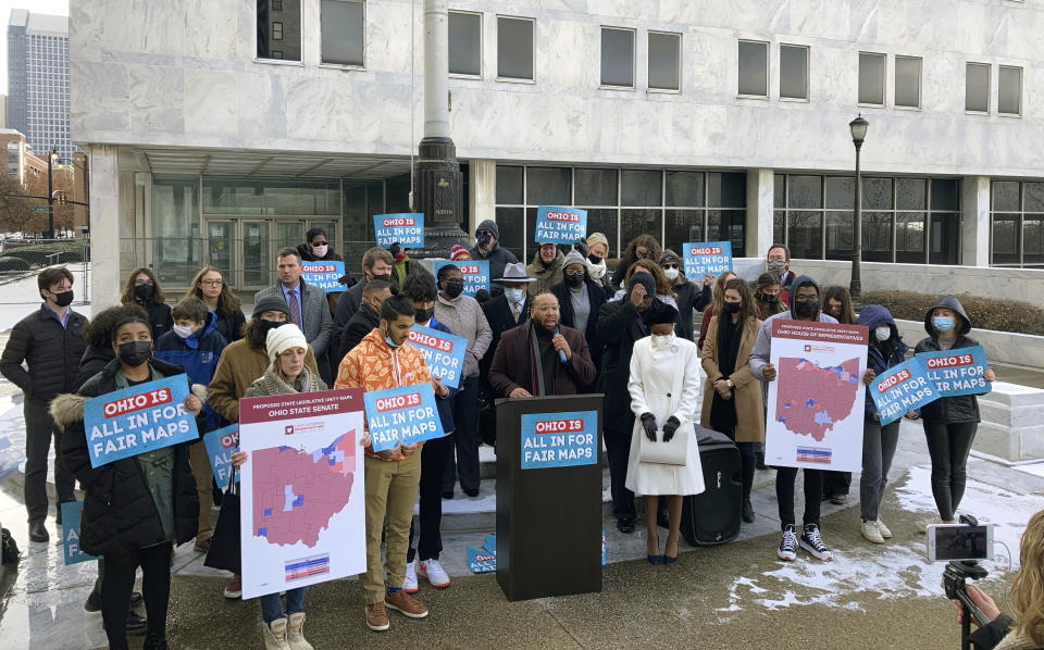 FILE - Advocates who believe that newly drawn Ohio legislative maps remain heavily gerrymandered rally outside the Ohio Supreme Court on Wednesday, Dec. 8, 2021, in Columbus, Ohio. Campaigns for Congress already are underway for this year's elections, but lingering disagreements over the final shape of new voting districts has left some candidates, and would-be candidates, in limbo. A few states have yet to enact new congressional districts following the 2020 census and some had their maps struck down by courts. (AP Photo/Andrew Welsh-Huggins, File)