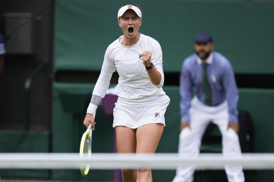 Barbora Krejcikova of the Czech Republic reacts after winning a point against Jasmine Paolini of Italy during the women's singles final at the Wimbledon tennis championships in London, Saturday, July 13, 2024. (AP Photo/Kirsty Wigglesworth)