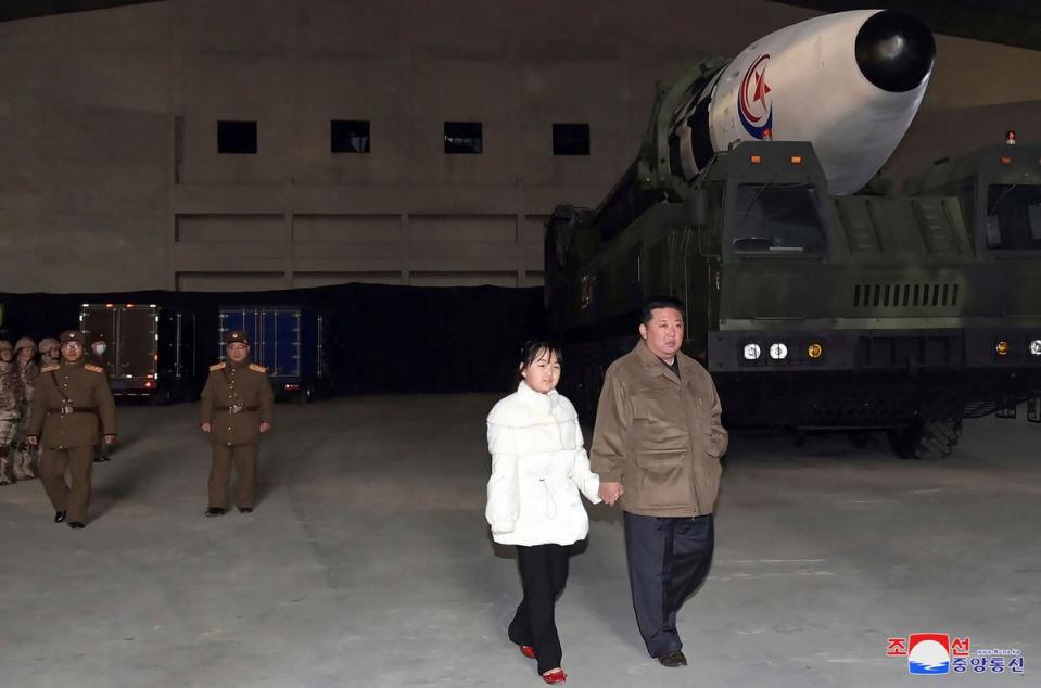 North Korean leader Kim Jong Un, right, and his daughter inspect a missile at Pyongyang International Airport in Pyongyang