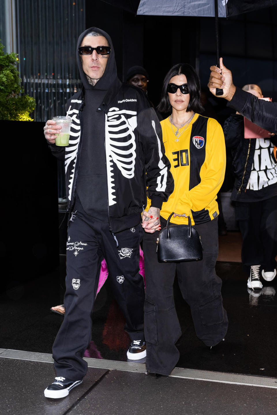 NEW YORK, NEW YORK - MAY 20: Travis Barker (L) and Kourtney Kardashian are seen in Midtown on May 20, 2023 in New York City. (Photo by Gotham/GC Images)