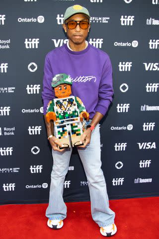 <p>Isaiah Trickey/FilmMagic</p> Pharrell Williams attends the premiere of 'Piece by Piece' — September 2024