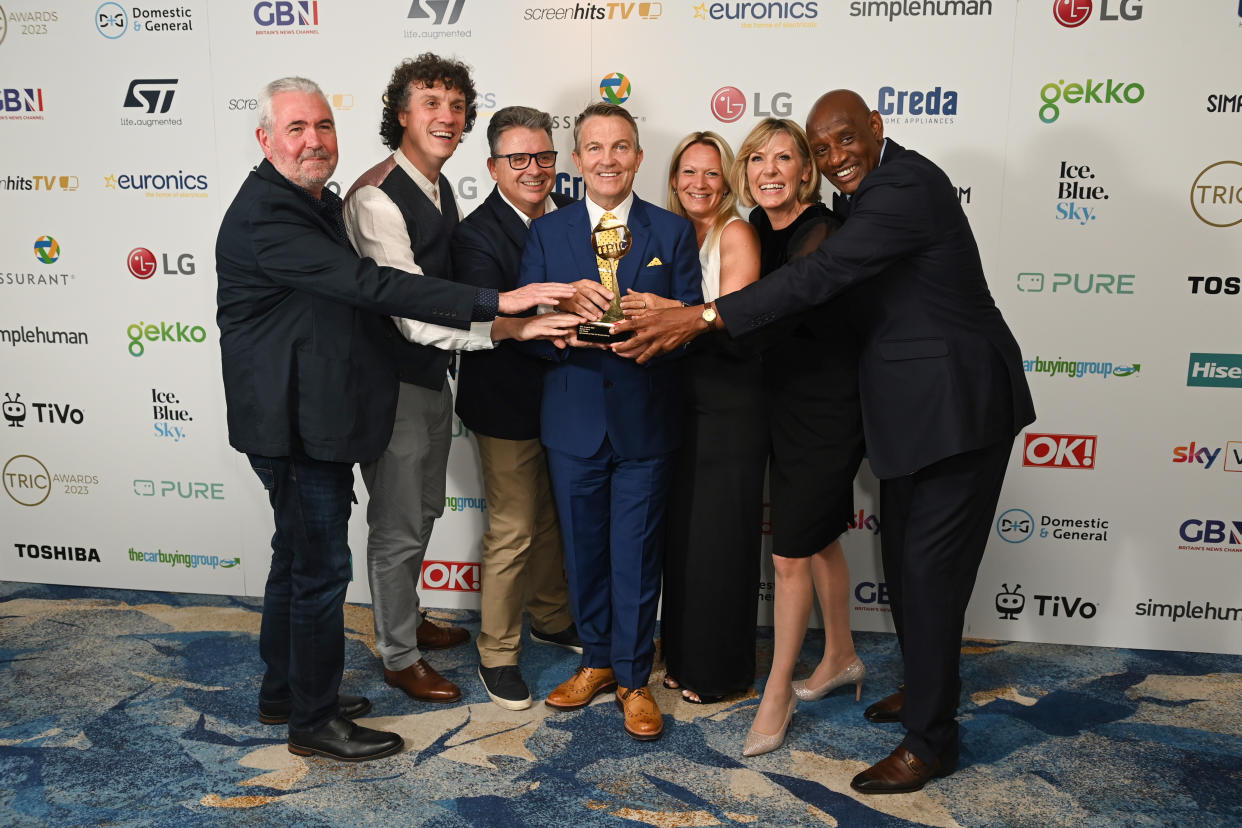 Darragh Ennis, Bradley Walsh and Shaun Wallace join the show's team to celebrate The Chase's victory at the TRIC Awards 2023. (Kate Green/Getty Images)