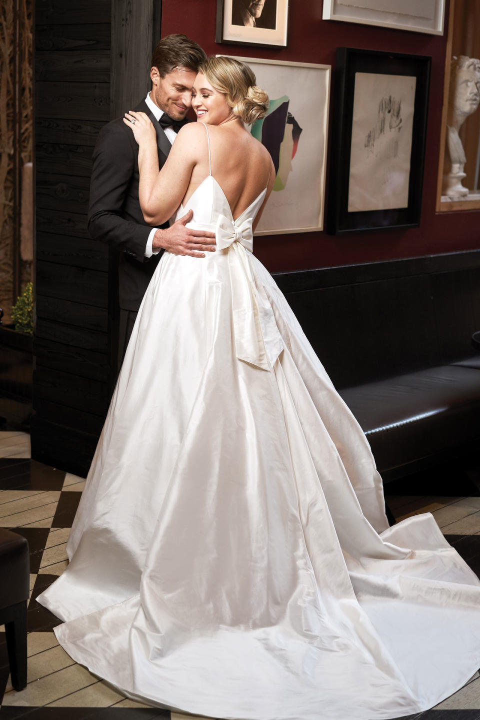 <p>Lawrence wears a voluminous white full-skirt gown with back bow detail by Justin Alexander. (Photo: courtesy of Justin Alexander) </p>