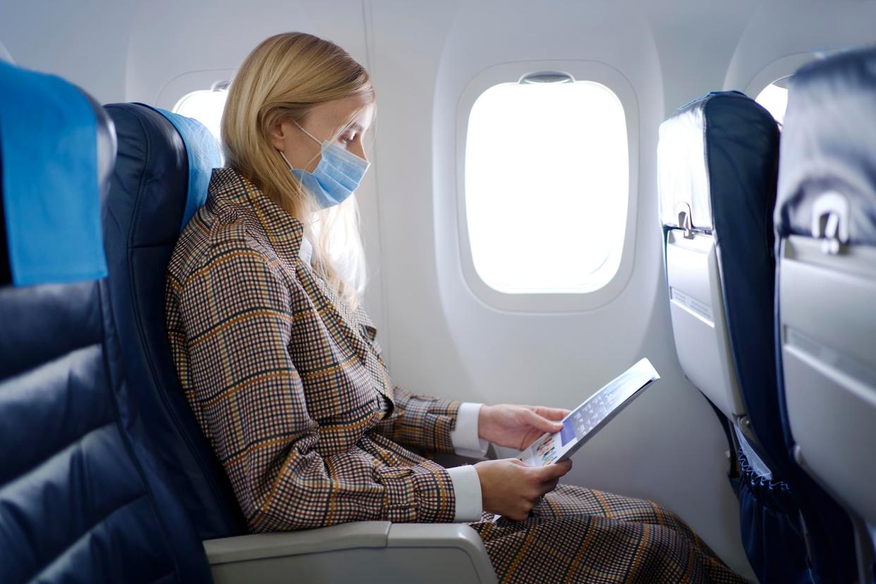 Even after getting the COVID-19 vaccine, you should wear a protective mask if you have to fly. (Photo: Getty Images)