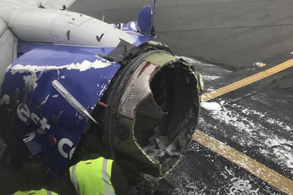 The engine on the Boeing 737 as it sits on the runway following the explosion (AP