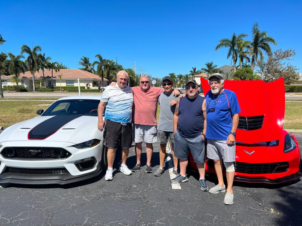 From left to right, Fred Steiner, Larry Drozd, Tony Costantino, Al Librandi and Sal Soldano pose with a Mustang and Corvette at their weekly muscle car meet-up at Marco Lutheran Church on Oct. 1. Not even Hurricane Ian could delay their gathering.