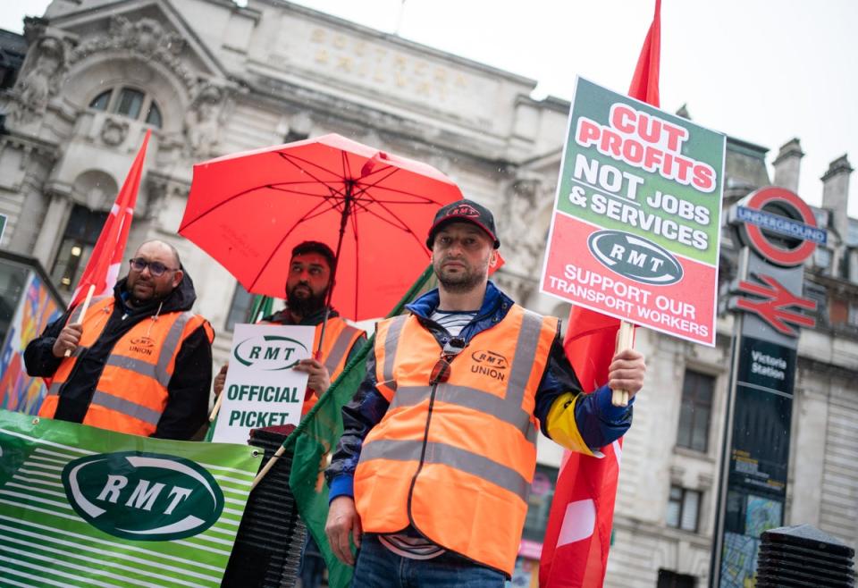 Members of the RMT union on a picket line outside Victoria station in London (Dominic Lipinski/PA) (PA Wire)