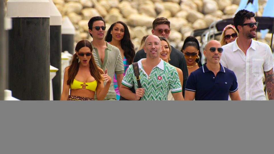 Polly Brindle, Gio Helou, Brandi Marshall, Jason Oppenheim, Alex Hall, Austin Victoria, Kayla Cardona, Brett Oppenheim, Alexandra Jarvis and Tyler Stanaland walking in yacht wear in Selling the OC season 2