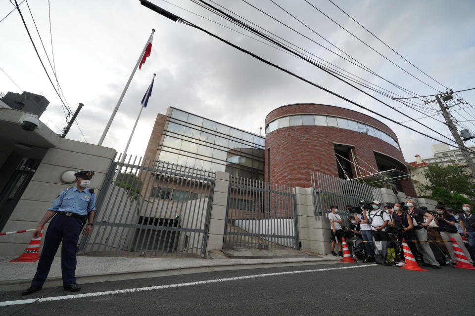 Media crews gather in front of the Embassy of Poland in Tokyo, Japan, after Belarusian Olympic athlete Krystsina Tsimanouskaya visited the embassy Monday, Aug. 2, 2021. The Olympic sprinter plans to seek asylum in Poland after alleging that officials tried to force her home, where she feared for her safety, an activist group said Monday. (AP Photo/Kantaro Komiya)