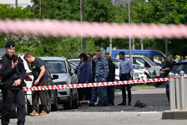 PHOTO: Law enforcement officers and investigators are seen outside a damaged multi-storey apartment building after a reported drone attack in Moscow on May 30, 2023. (Kirill Kudryavtsev/AFP via Getty Images)