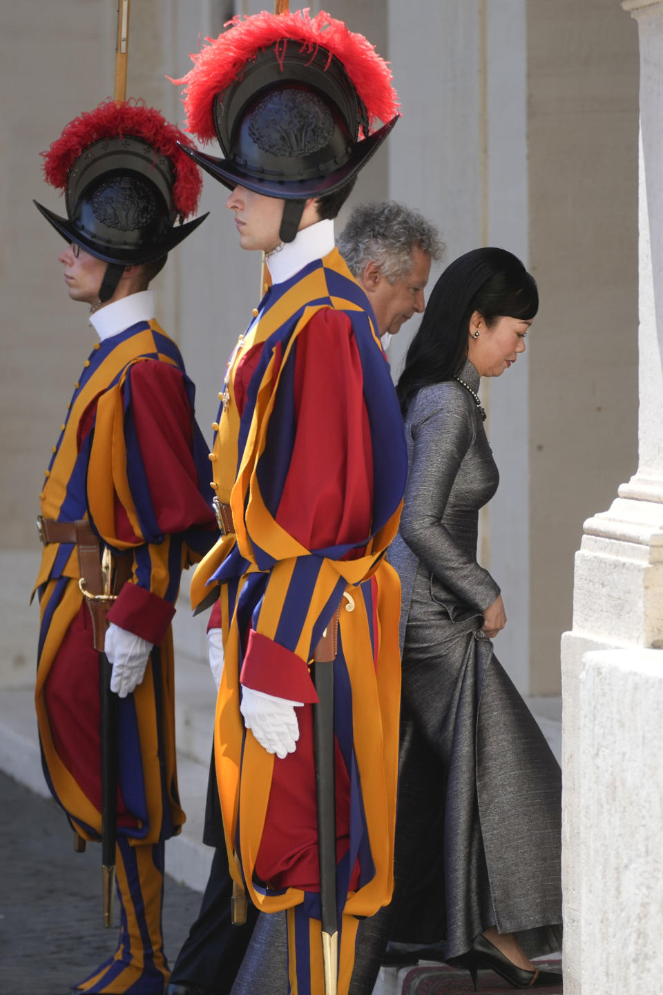 Pham Thi Thanh Tam, the wife of Vietnam President Vo Van Thuong, walks past Swiss Guards upon her arrival in the San Damaso Courtyard to meet with Pope Francis at the Vatican, Thursday, July 27, 2023. (AP Photo/Gregorio Borgia)