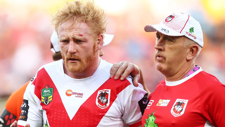 James Graham is helped from the field by St George Illawarra trainers during the 2018 elimination final.