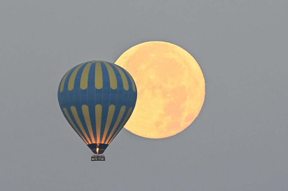 Hot air balloons in Capaddocia during a night of full moon
