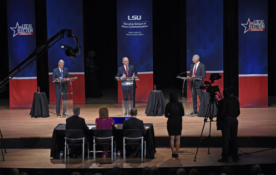 FILE - In this Sept. 19, 2019, file photo, from left, Eddie Rispone, Gov. John Bel Edwards and Republican Rep. Ralph Abraham participate in the first televised gubernatorial debate in Baton Rouge, La. Two main candidates are vying against Edwards on the ballot: Abraham, a third-term congressman and doctor from rural northeast Louisiana, and Rispone, a Baton Rouge businessman and longtime political donor who is largely self-financing his first bid for office. (Bill Feig/The Advocate via AP, Pool, File)