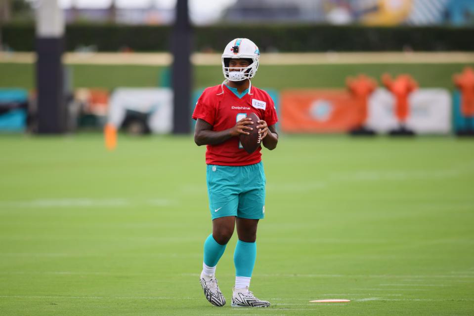 Jul 24, 2024; Miami Gardens, FL, USA; Miami Dolphins quarterback Tua Tagovailoa (1) holds the football during training camp at Baptist Health Training Complex. Mandatory Credit: Sam Navarro-USA TODAY Sports