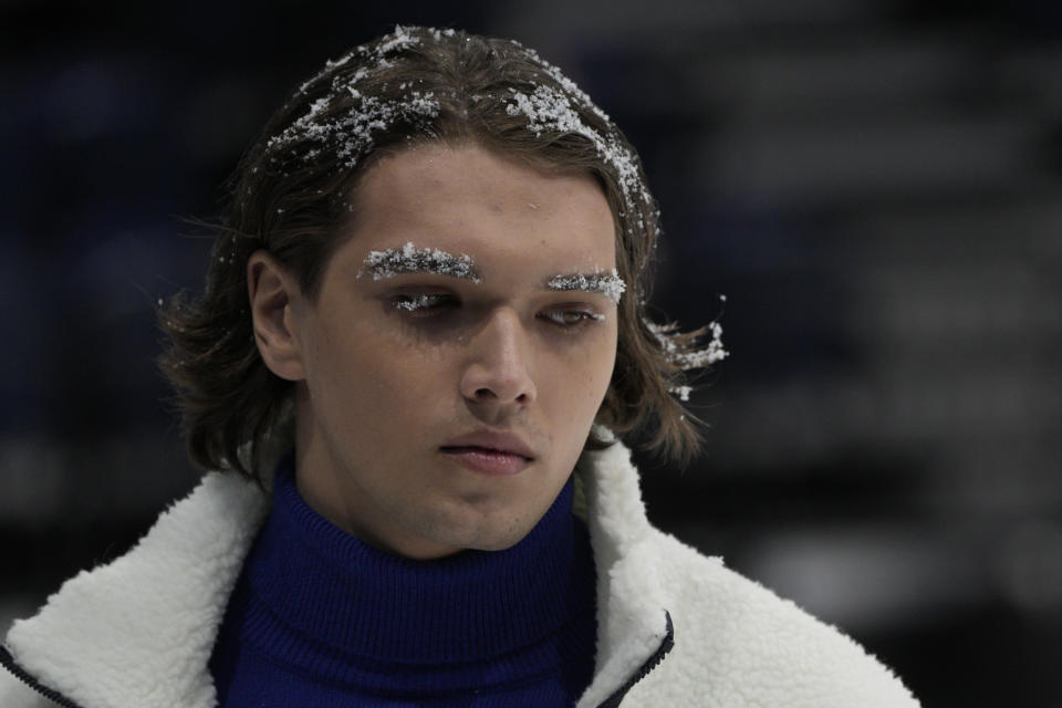 A model displays the Olympic uniforms for Russian athletes in Moscow, Russia, Friday, Dec. 10, 2021. Russia presents its Olympic kit for the Beijing Winter Olympics 2022, which shouldn't depict any symbols of the country. Russian athletes will compete at the Tokyo Olympics as neutral after the Court of Arbitration for Sport last December banned Russia from using its name, flag and anthem at any world championships because of state-backed doping. (AP Photo/Pavel Golovkin)