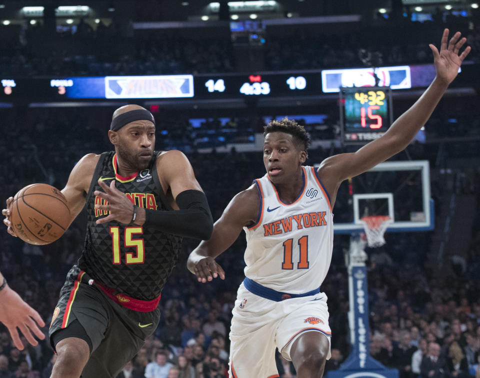 Atlanta Hawks guard Vince Carter (15) drives to the basket against New York Knicks guard Frank Ntilikina (11) during the first half of an NBA basketball game, Wednesday, Oct. 17, 2018, at Madison Square Garden in New York. (AP Photo/Mary Altaffer)