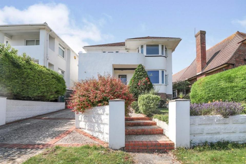 £920,000: this Art Deco four-bedroom home in Saltdean, Brighton,  has sea views from the first-floor balcony (Fox & Sons)