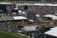 FILE - In this May 17, 2014, file photo, fans walk in the infield before the 139th Preakness Stakes horse race at Pimlico Race Course in Baltimore. The Maryland Jockey Club and New York Racing Association have yet to announce new dates for the Preakness and Belmont. The Kentucky Derby is scheduled for Sept. 5. (AP Photo/Mike Stewart, File)