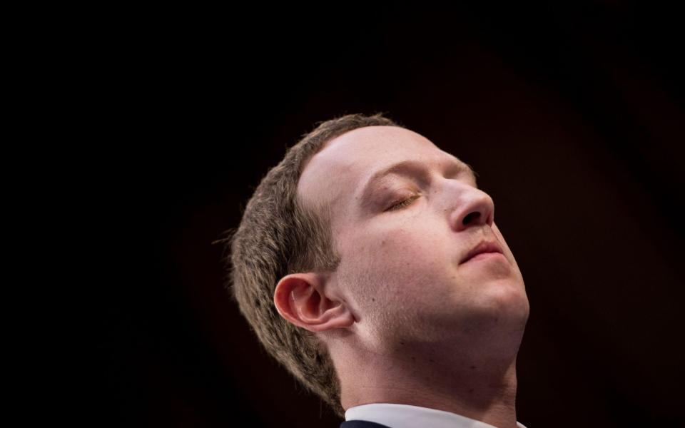 Facebook CEO Mark Zuckerberg listens during a joint hearing of the Senate Commerce, Science and Transportation Committee and Senate Judiciary Committee on Capitol Hill April 10, 2018 in Washington, DC - Brendan Smialowski/AFP