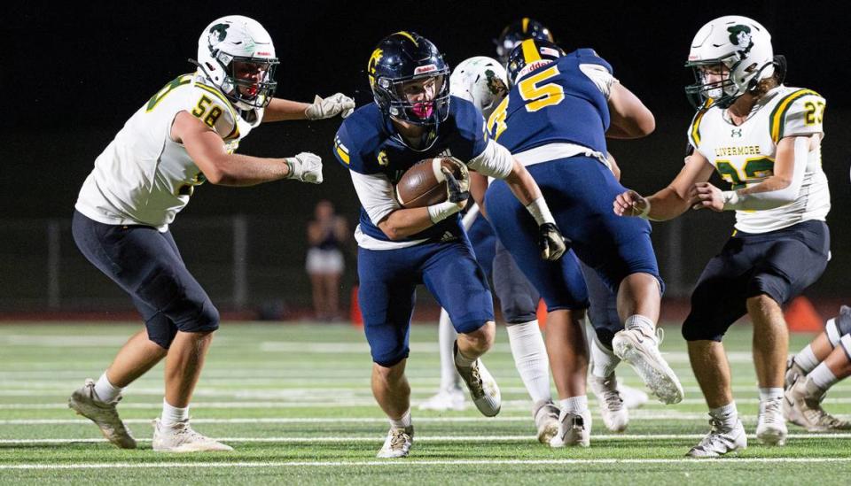 Gregori’s Michael Marsden breaks through the Livermore defense on a touchdown run at Gregori High School in Modesto, Calif., Friday, September 8, 2023. Gregori won the game 41-17.