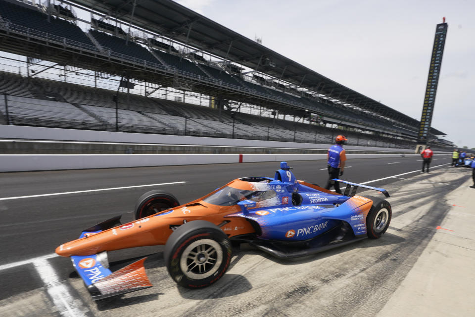 Scott Dixon, of New Zealand, leaves the pits during practice for the Indianapolis 500 auto race at Indianapolis Motor Speedway, Thursday, May 19, 2022, in Indianapolis. (AP Photo/Darron Cummings)