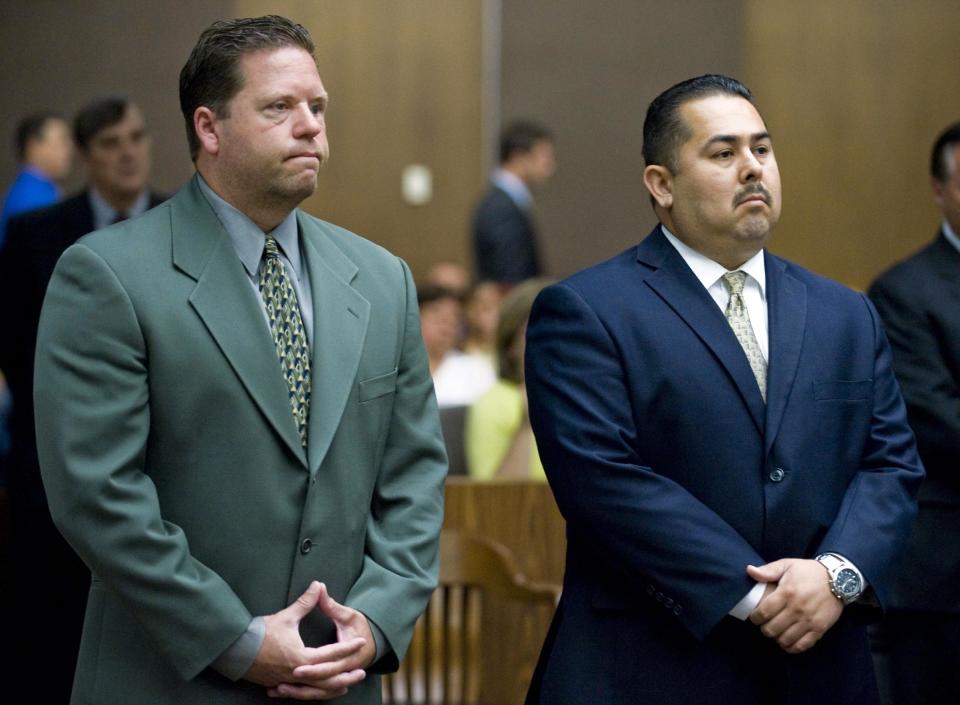 FILE - This July 13, 2012 file photo shows Fullerton police officer Jay Cicinelli, left, and former Fullerton police officer Manuel Ramos, right, appearing at Orange County Superior Court in Santa Ana. Opening statements are underway in the trial of Cicinelli and Ramos, charged in the death of Kelly Thomas, a homeless man whose family says was schizophrenic. Closing arguments are scheduled to begin Tuesday, Jan. 7, 2013. (AP Photo/The Orange County Register, Mark Rightmire, File) MAGS OUT; LOS ANGELES TIMES OUT