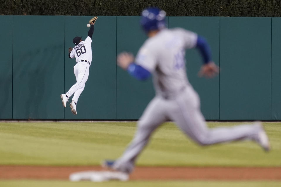 Detroit Tigers center fielder Akil Baddoo (60) can't reach a Kansas City Royals' Jorge Soler fly ball as Sebastian Rivero (48) rounds second base in the ninth inning of a baseball game in Detroit, Tuesday, May 11, 2021. (AP Photo/Paul Sancya)