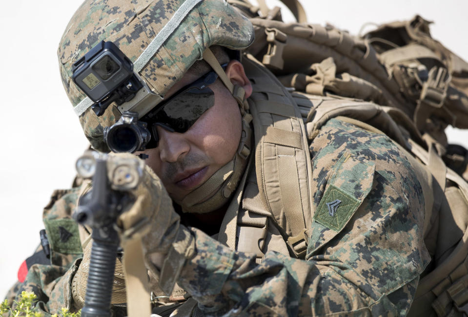 FILE - In this Monday, June 4, 2018 file photo a U.S. marine takes part in a landing operation during military Exercise Baltops 2018 at the Baltic Sea near village Nemirseta in Klaipeda district, some 340 kms (211 miles) west north of the capital Vilnius, Lithuania. Lithuania. The American military says it’s preparing a massive exercise early next year in Europe involving 20,000 soldiers from the U.S., the largest deployment across the Atlantic in more than 25 years for training. (AP Photo/Mindaugas Kulbis, file)