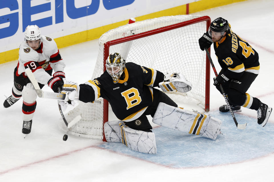 Boston Bruins' Linus Ullmark (35) blocks a shot by Ottawa Senators' Drake Batherson (19) during the third period of an NHL hockey game, Monday, Feb. 20, 2023, in Boston. (AP Photo/Michael Dwyer)