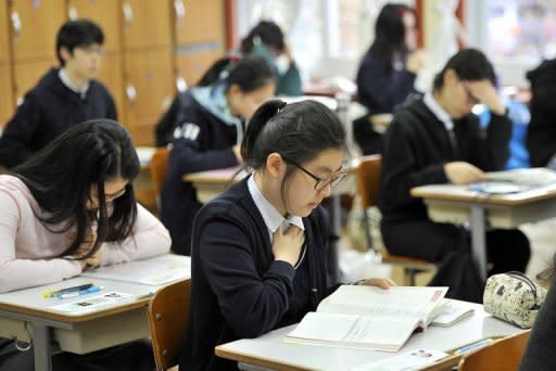 South Korean students prepare to take the College Scholastic Ability Test, a standardised exam for college entrance, at a high school in Seoul, in 2011. As every year, the focus of the education-obsessed country narrowed for one day to ensuring the smooth running of the exam, seen as a defining moment that can hold the key to everything from future careers to marriage prospects