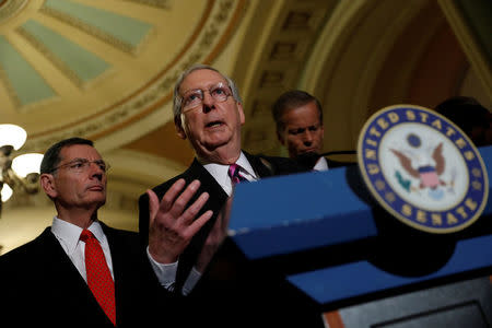 Senate Majority Leader Mitch McConnell, accompanied by Senator John Barrasso (R-WY) and Senator John Thune (R-SD), speaks with reporters following the party luncheons on Capitol Hill in Washington, U.S., August 1, 2017. REUTERS/Aaron P. Bernstein