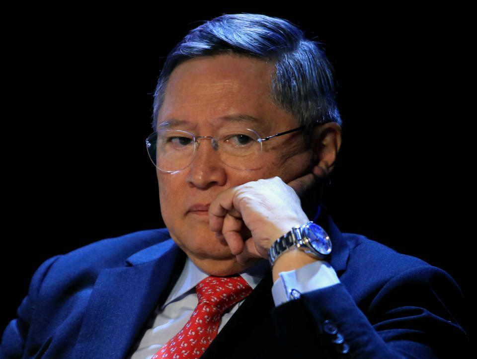Philippine Finance Secretary Carlos Dominguez gestures as he listens to questions during a 