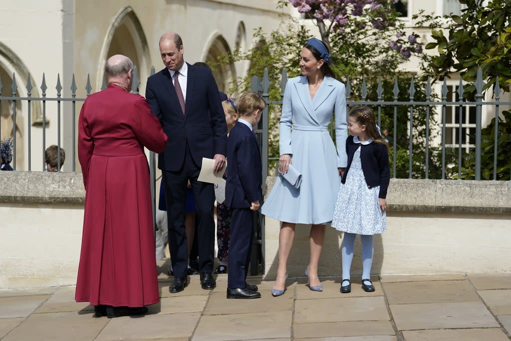 The Duke and Duchess of Cambridge, Princess Charlotte and Prince George, shake hands with Dean of Windsor, the Right Rev David Conner (Andrew Matthews/PA) (PA Wire)