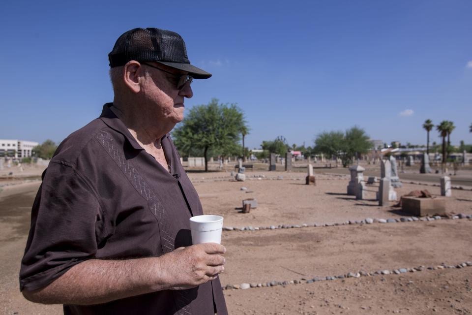 Frank Barrios is pictured on Sept. 20, 2018, at Pioneer & Military Memorial Park in Phoenix. Some of the headstones from the historic Sotelo-Heard Cemetery have been moved to their current location to prevent vandalism.