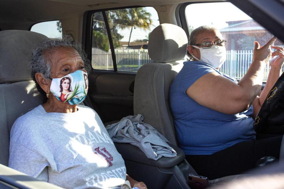 Gladis Mesino, 82, and Teresa Mesino, 68, wait in line inside a vehicle at the first walk-up mobile testing site open to Florida residents that won’t require appointments at Miami Carol City Park in Miami Gardens, Florida, on Saturday, Feb. 20, 2021.