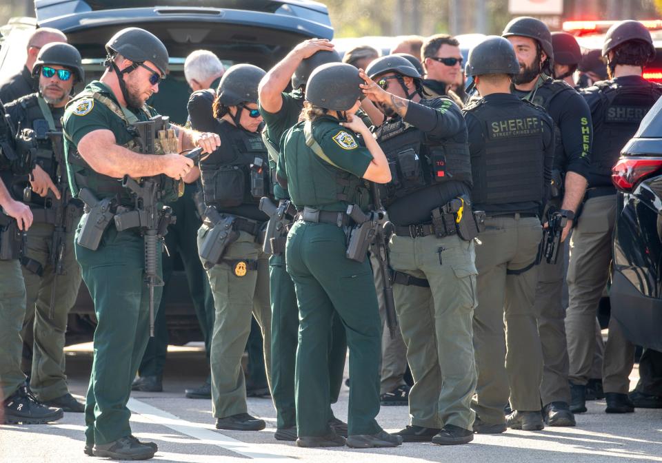 PBSO deputies prepare outside the Gardens Mall after a shooting there on February 14, 2024, in Palm Beach Gardens, Florida.