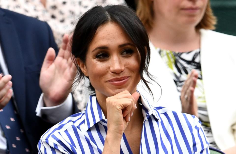 <p>Meghan Markle looks pleased to be watching the women's final.</p>