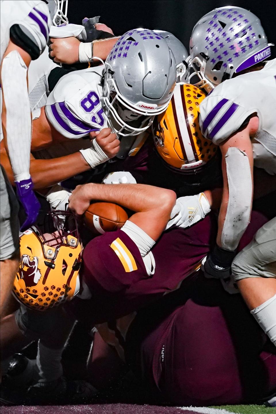 Bloomington North’s Dash King (with ball) scores a touchdown during the IHSAA sectional semi-final football game at Bloomington North on Friday, Oct. 27, 2023.