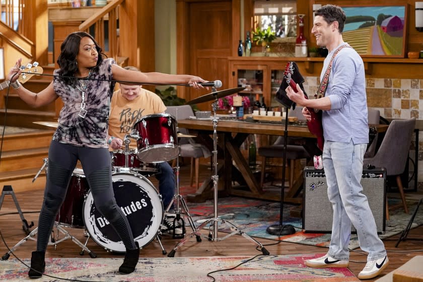 The Neighborhood -- CBS TV Series, "Welcome to the Dad Band" - Pictured: Tichina Arnold (Tina Butler) and Max Greenfield (Dave Johnson). When Dave's amateur band loses its lead singer just before a gig, Tina offers to fill in, however her high standards are out of tune with the rest of the group. Also, Marty quickly regrets letting his needy boss, Jerry (guest star Samm Levine), crash at his new place, on THE NEIGHBORHOOD, Monday, March 8 (8:00-8:30 PM, ET/PT) on the CBS Television Network. Photo: Monty Brinton/CBS ©2021 CBS Broadcasting, Inc. All Rights Reserved. Tichina Arnold and Max Greenfield in "The Neighborhood" on CBS.