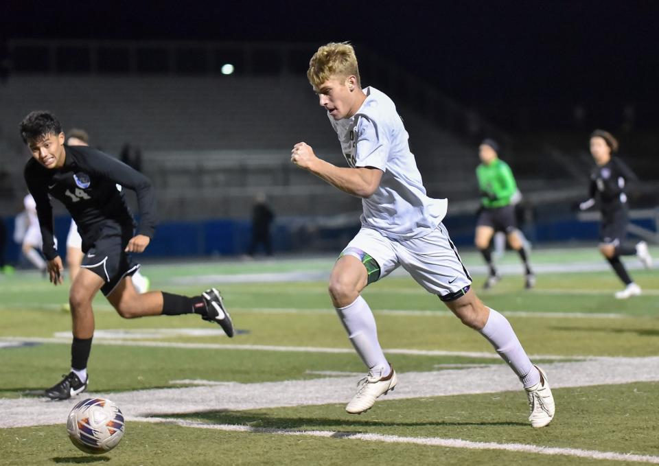 Oak Park's Tyler Cash tries to race past the Alta Loma defense during the Eagles' 2-1 win in double overtime in a CIF-SS Division 1 second-round game at Alta Loma High on Friday, Feb. 9, 2024. Cash scored the golden goal to lift the Eagles into the quarterfinals.