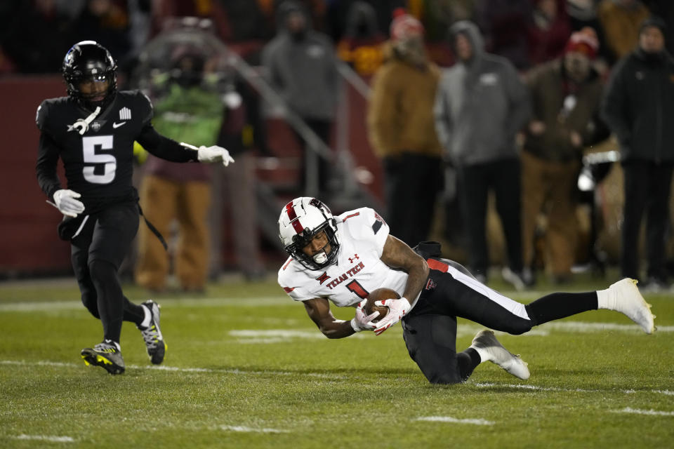 Texas Tech wide receiver Myles Price (1) catches a pass ahead of Iowa State defensive back Myles Purchase (5) before an NCAA college football game, Saturday, Nov. 19, 2022, in Ames, Iowa. (AP Photo/Charlie Neibergall)