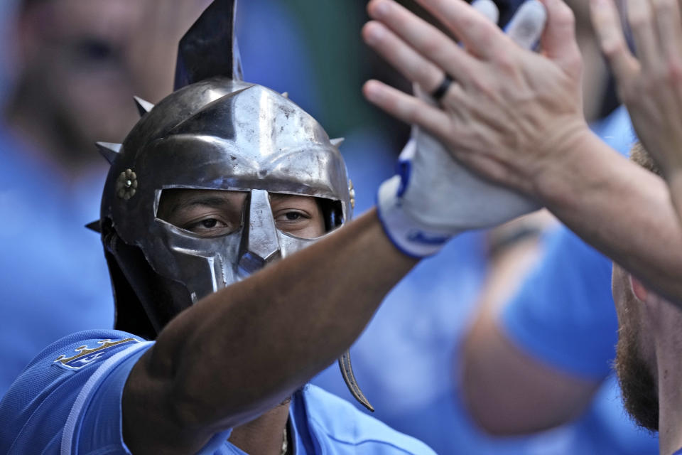 Kansas City Royals' Edward Olivares celebrates in the dugout after hitting a two-run home run during the fifth inning of a baseball game against the Chicago White Sox Monday, Sept. 4, 2023, in Kansas City, Mo. (AP Photo/Charlie Riedel)